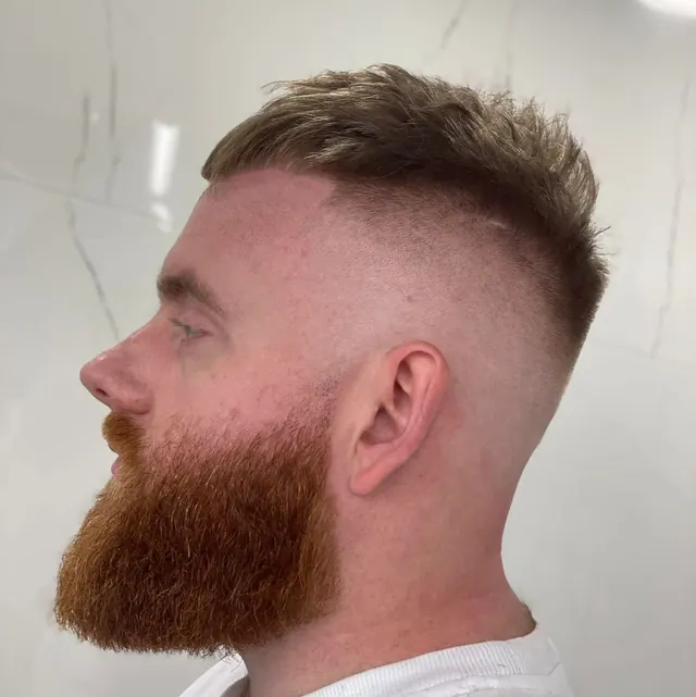 A crop and a full beard shaped at Fredo's
